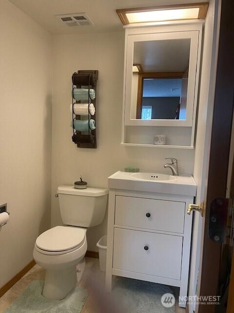22507 SE 304th Pl, Black Diamond, WA 98010 - half bath with vanity, toilet, and baseboards