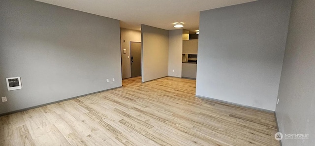 empty room with light wood-type flooring