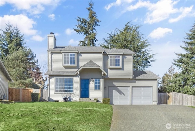 front of property with a garage and a front yard