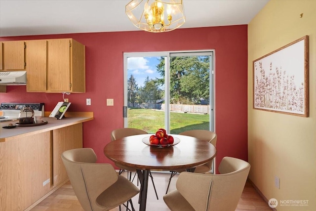 dining area featuring a notable chandelier