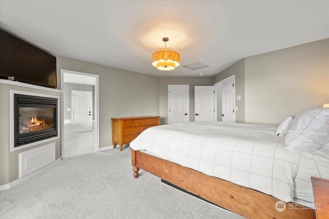 bedroom featuring light colored carpet