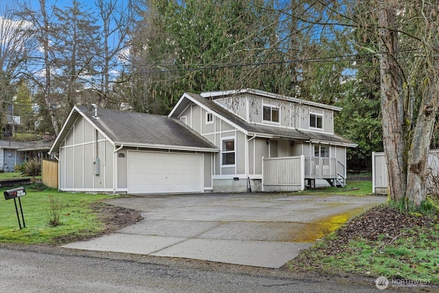 view of front facade featuring aphalt driveway, a garage, a shingled roof, board and batten siding, and a front yard