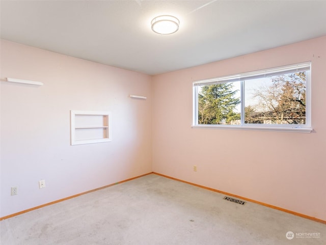 spare room with carpet flooring