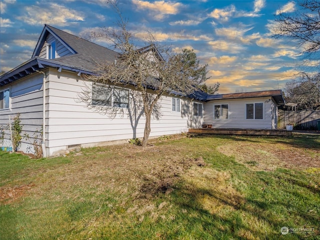 back of house with a yard