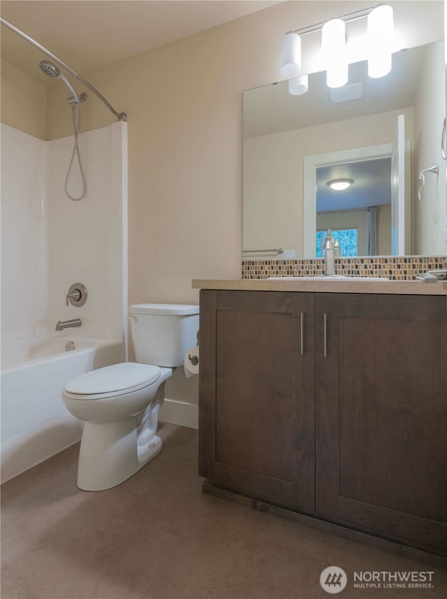 bathroom featuring toilet, tile patterned flooring, tub / shower combination, and vanity