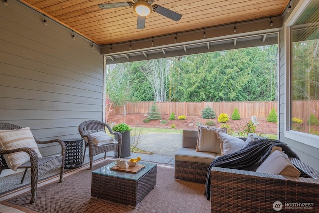 view of patio / terrace with a fenced backyard, ceiling fan, and outdoor lounge area