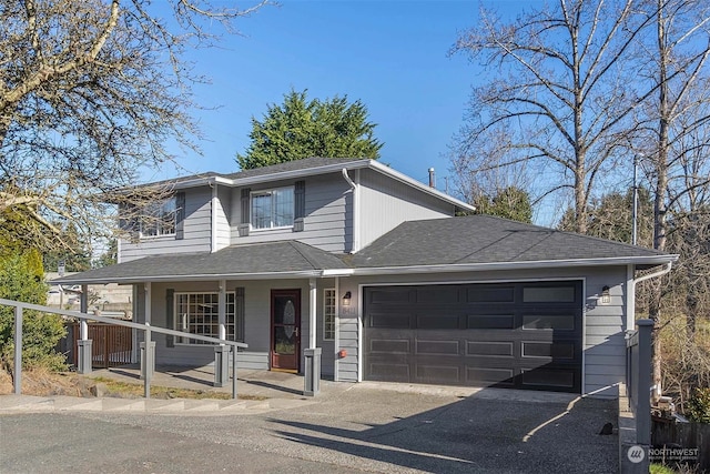 view of front of home with a garage and a porch