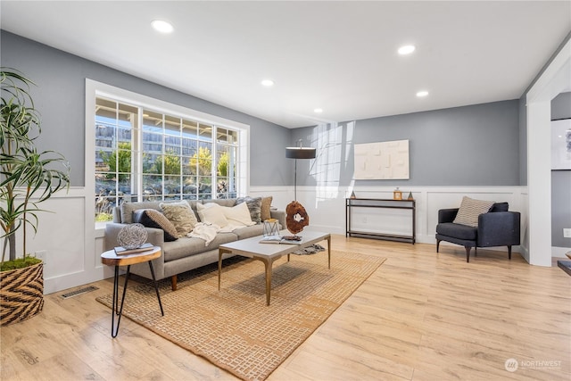 living room with light hardwood / wood-style flooring