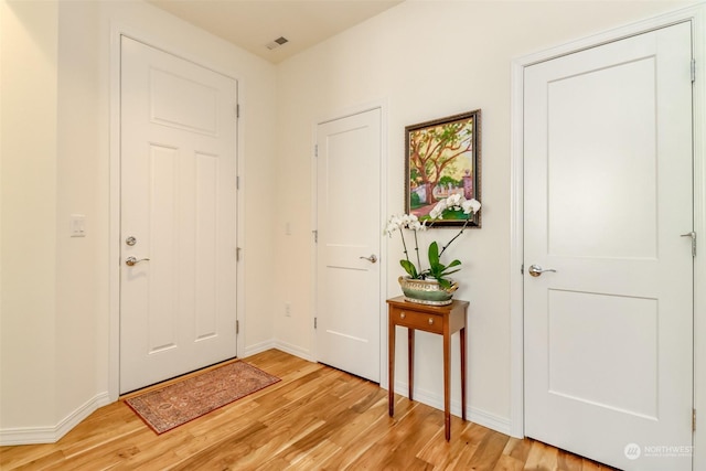 entrance foyer featuring light hardwood / wood-style floors