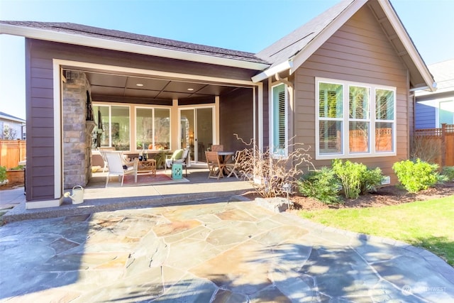 rear view of property with a patio area