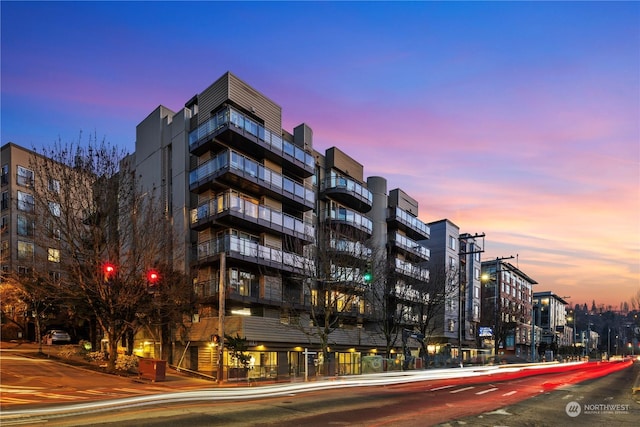 view of outdoor building at dusk