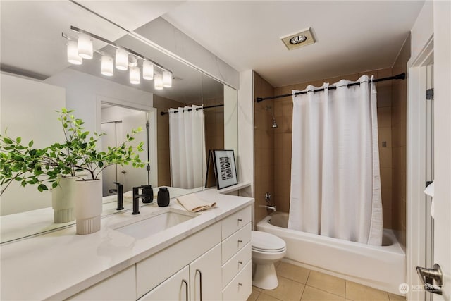 full bathroom featuring shower / bath combination with curtain, vanity, toilet, and tile patterned flooring