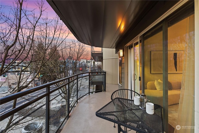 view of balcony at dusk