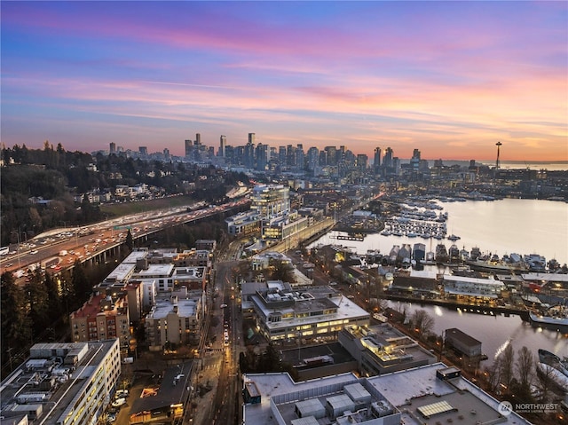 aerial view at dusk with a water view