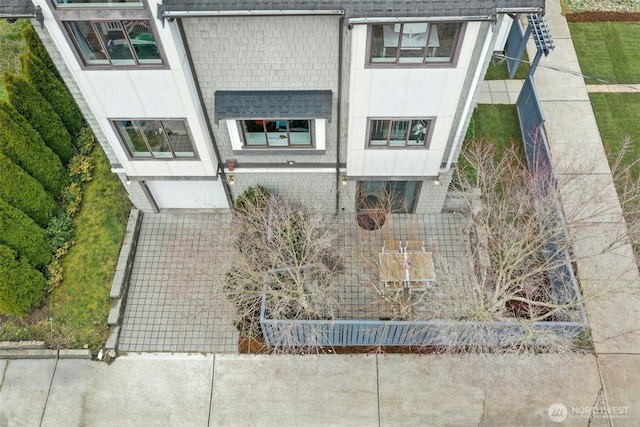 exterior space with a shingled roof