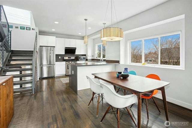 dining space with stairs, baseboards, dark wood-style flooring, and recessed lighting