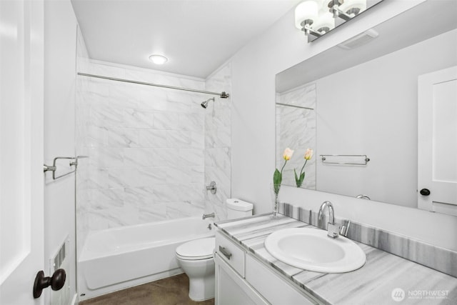 bathroom featuring toilet, bathing tub / shower combination, and vanity