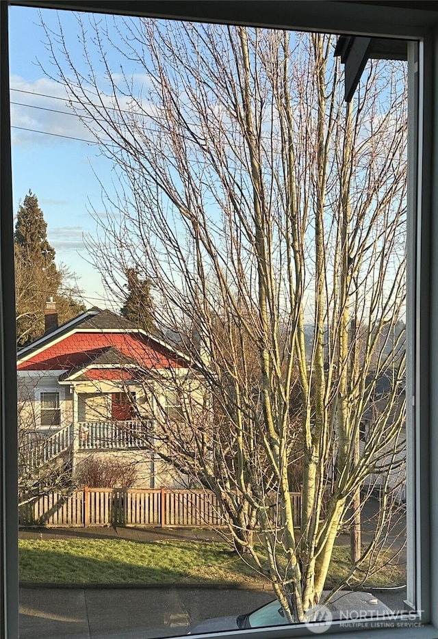 view of home's exterior with fence