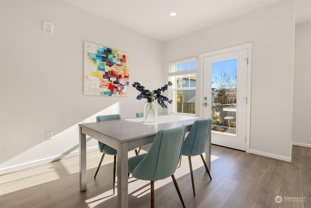 dining space featuring light wood-type flooring