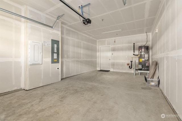 garage with strapped water heater, a garage door opener, and electric panel