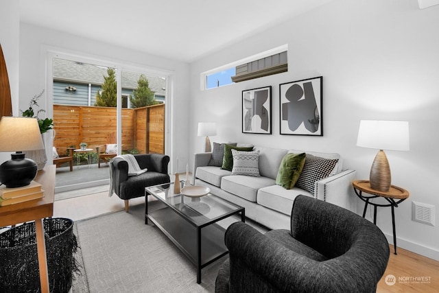 living room with light hardwood / wood-style flooring