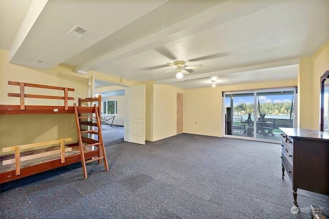 bedroom with multiple windows, access to exterior, ceiling fan, and dark colored carpet