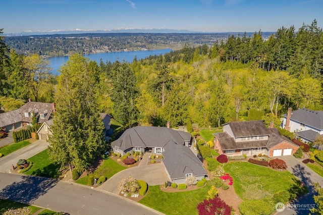 bird's eye view with a residential view, a forest view, and a water view