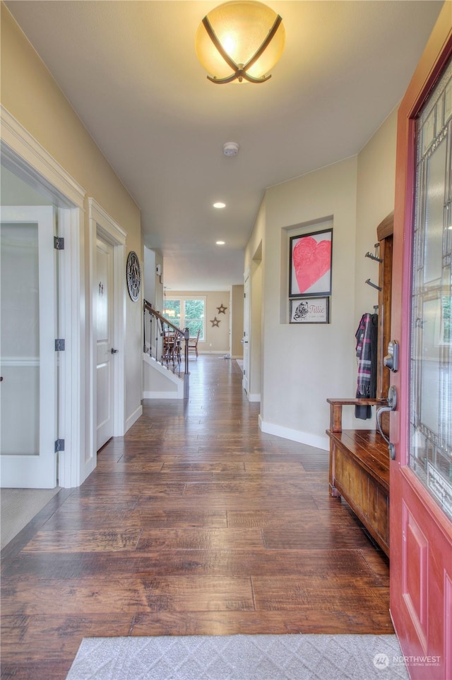 hallway with dark hardwood / wood-style floors