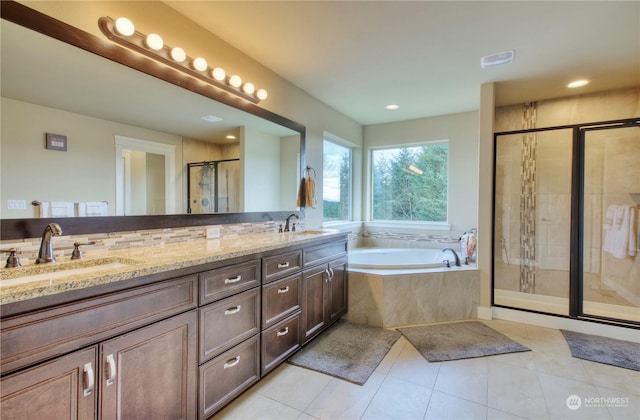 bathroom with vanity, shower with separate bathtub, and tile patterned flooring