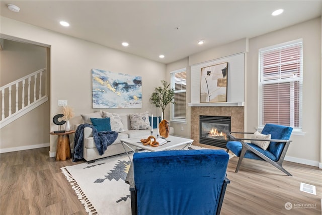 living room with a fireplace and hardwood / wood-style floors