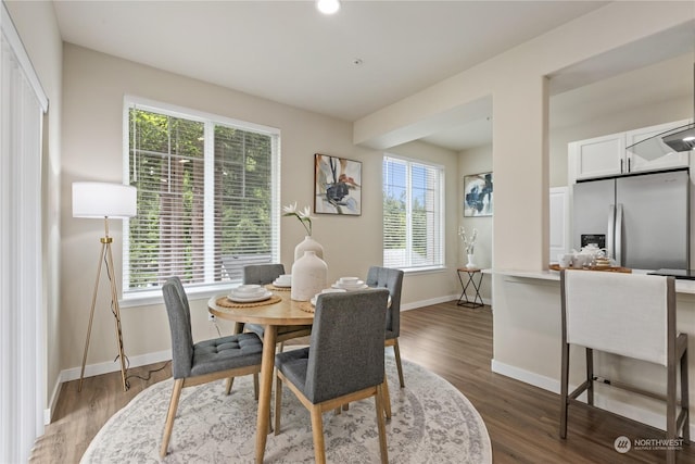 dining area with hardwood / wood-style floors