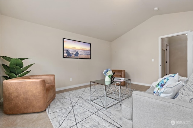 carpeted living room featuring vaulted ceiling