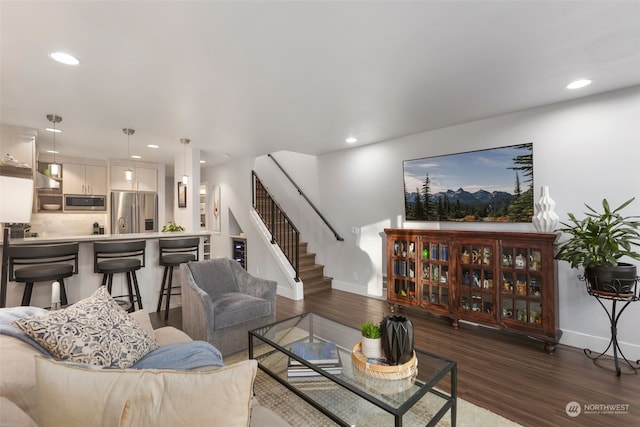 living room with dark hardwood / wood-style flooring