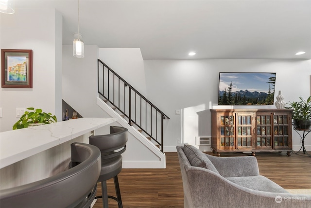 living room with dark hardwood / wood-style flooring