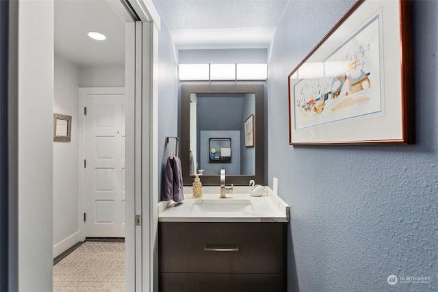 bathroom with vanity and a textured ceiling