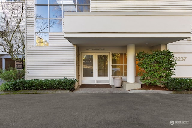 view of exterior entry featuring french doors