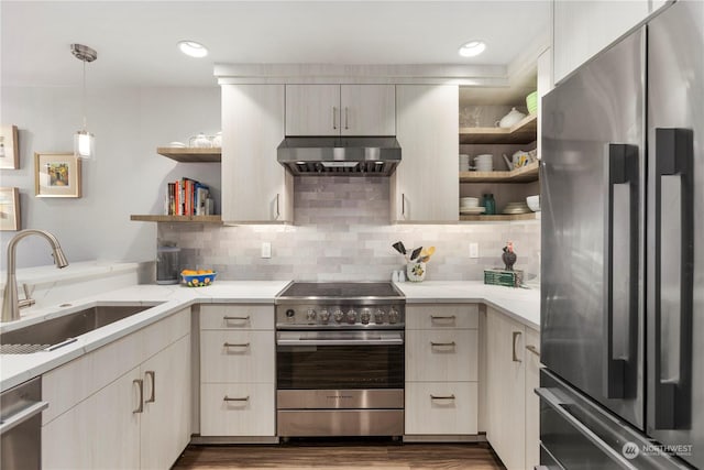 kitchen featuring extractor fan, appliances with stainless steel finishes, decorative light fixtures, tasteful backsplash, and sink