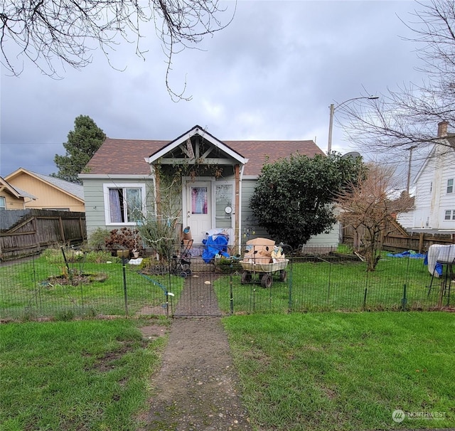 bungalow-style house featuring a front lawn