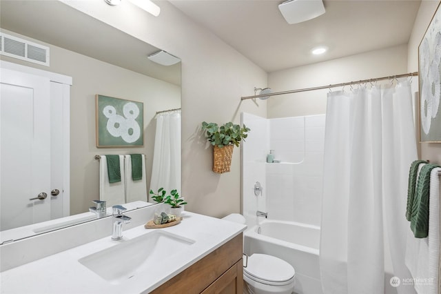 full bathroom featuring vanity, shower / tub combo with curtain, and toilet