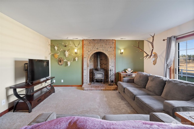 carpeted living room featuring a wood stove