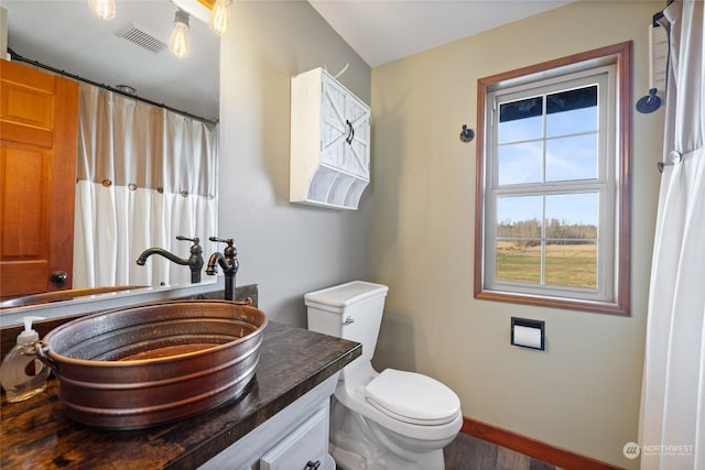 bathroom with vanity and toilet