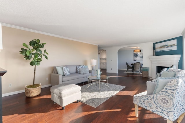 living room with ornamental molding and dark hardwood / wood-style floors