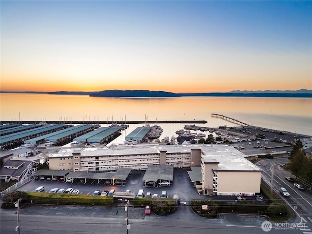 aerial view at dusk with a water view