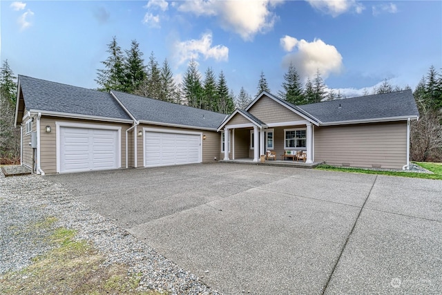 view of front of property with a garage and covered porch