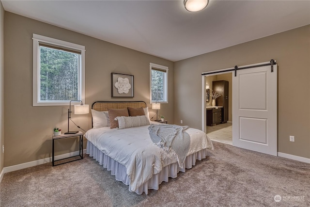 bedroom featuring light colored carpet, a barn door, and multiple windows