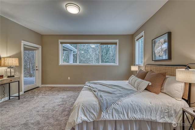 carpeted bedroom featuring access to outside