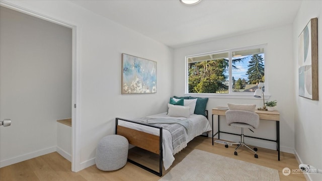 bedroom featuring hardwood / wood-style flooring