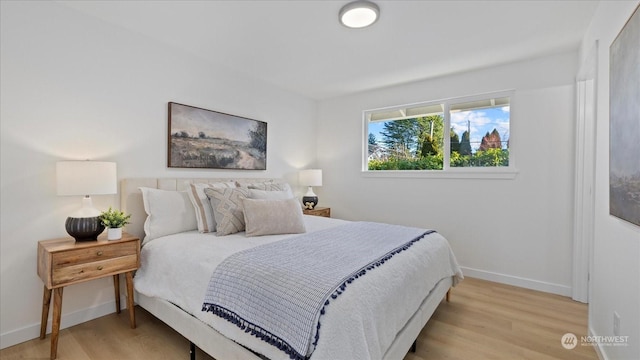 bedroom with light hardwood / wood-style flooring