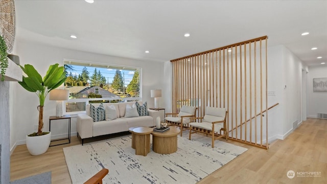 sitting room featuring light hardwood / wood-style flooring