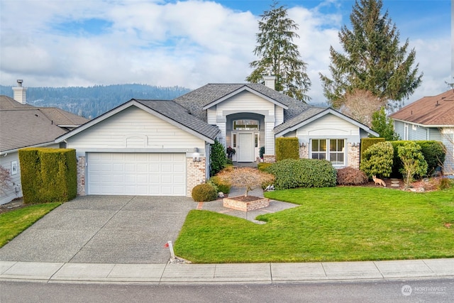 view of front facade with a garage and a front yard